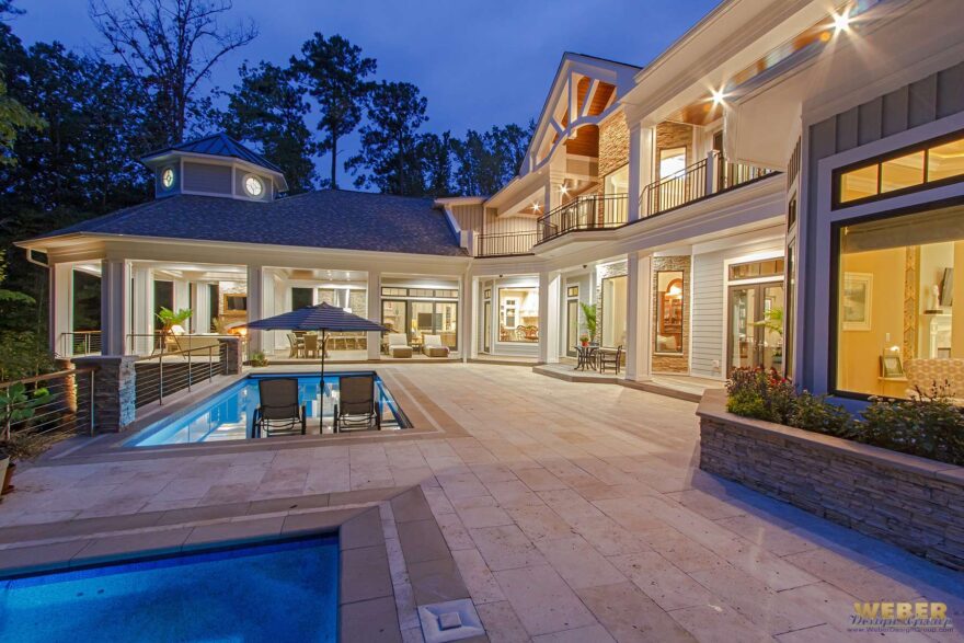 Summer outdoor living space with shaded patios, pergola, outdoor kitchen, and UV-resistant furniture for warm-weather comfort
